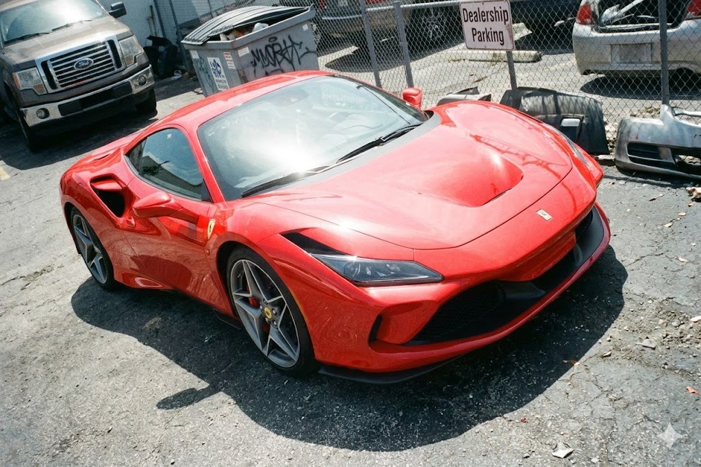 iPhone snapshot of the same Ferrari before professional merchandising