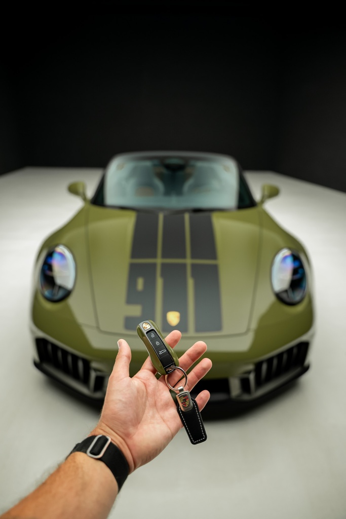 Porsche 911 key with olive green 911 in studio
