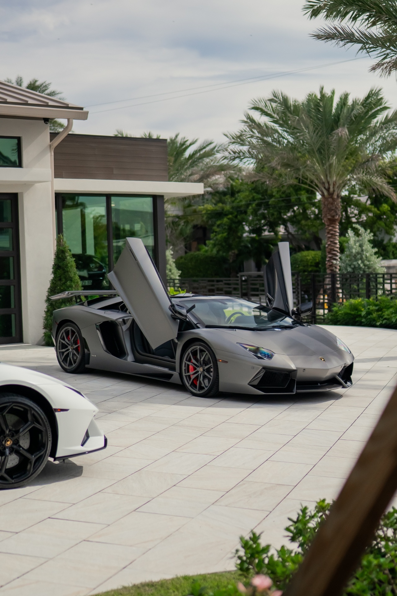 Lamborghini Aventador with doors up at a Miami home