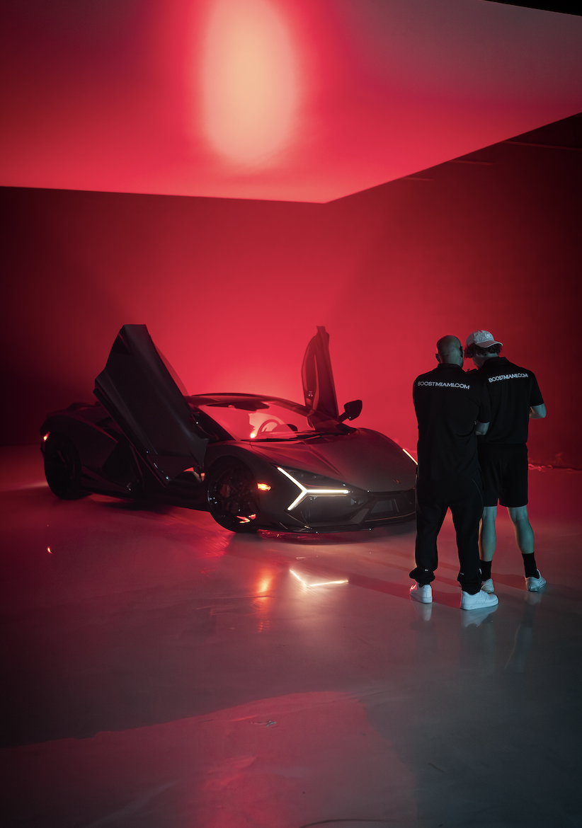 Boost Miami team on set with a Lamborghini